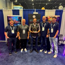 Alan-1 and Atari President accepting the IAAPA Brass Ring Award